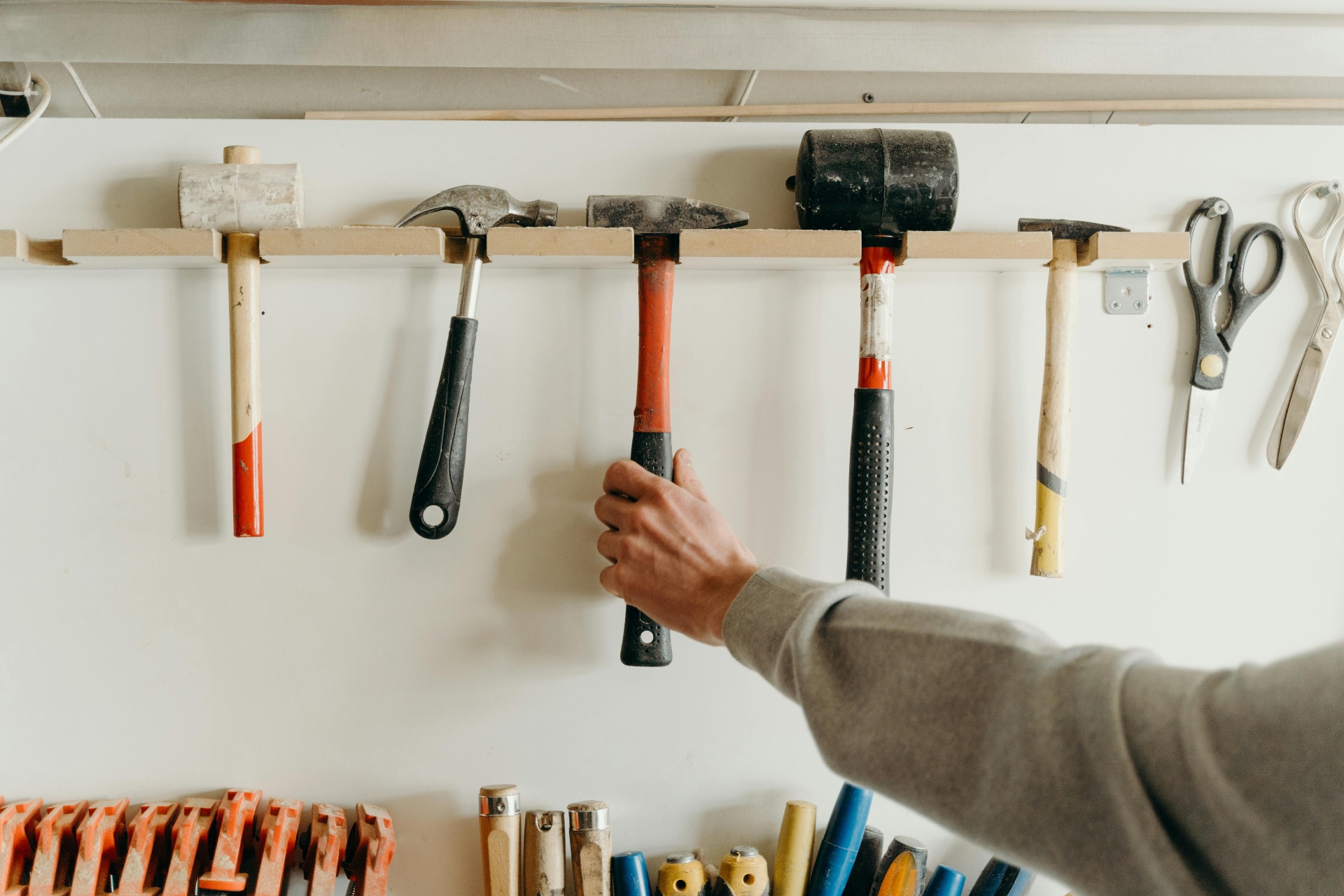 Wall of hammers in Nelson's workshop